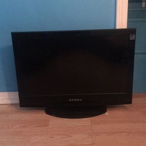 Black tv with a DVD on it